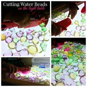 Fun fine motor light table activity for preschoolers! Cutting and squishing water beads on the light box!