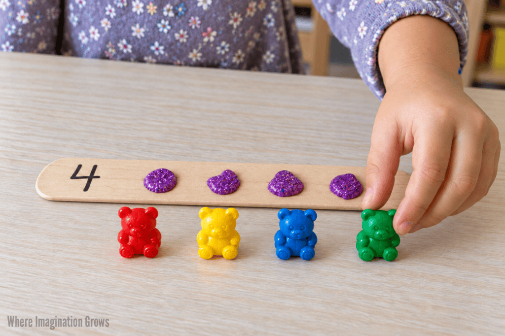 Craft stick counting activity for preschoolers with counting bears
