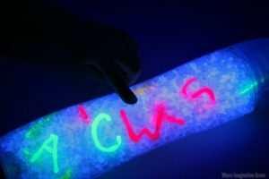 Glow in the Dark ABCs from hot glue! A fun I-Spy Sensory Bottle Game for Kids!