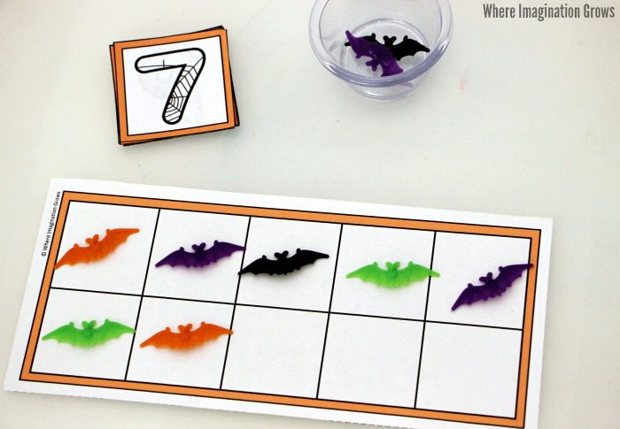 Preschool Halloween ten frame activity with colorful bat counters 